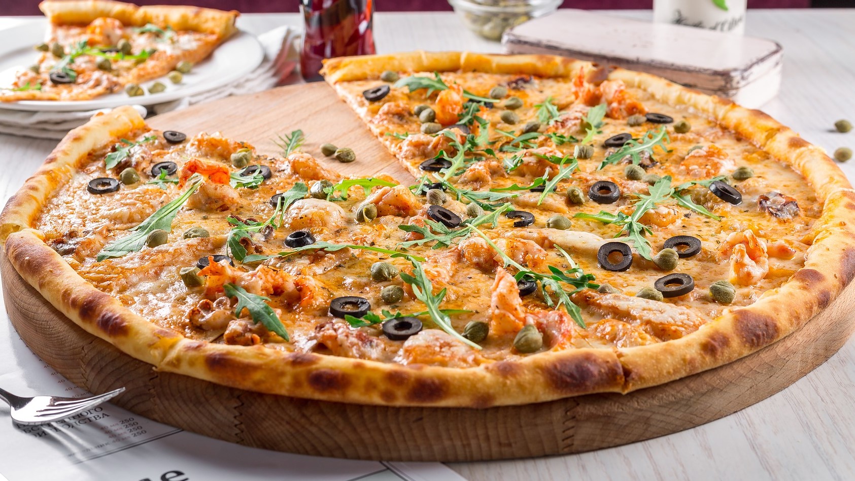 Pizza als Motiv der Dino-Bestellseite